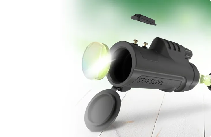 Starscope monocular with its lens cap and green-coated lens